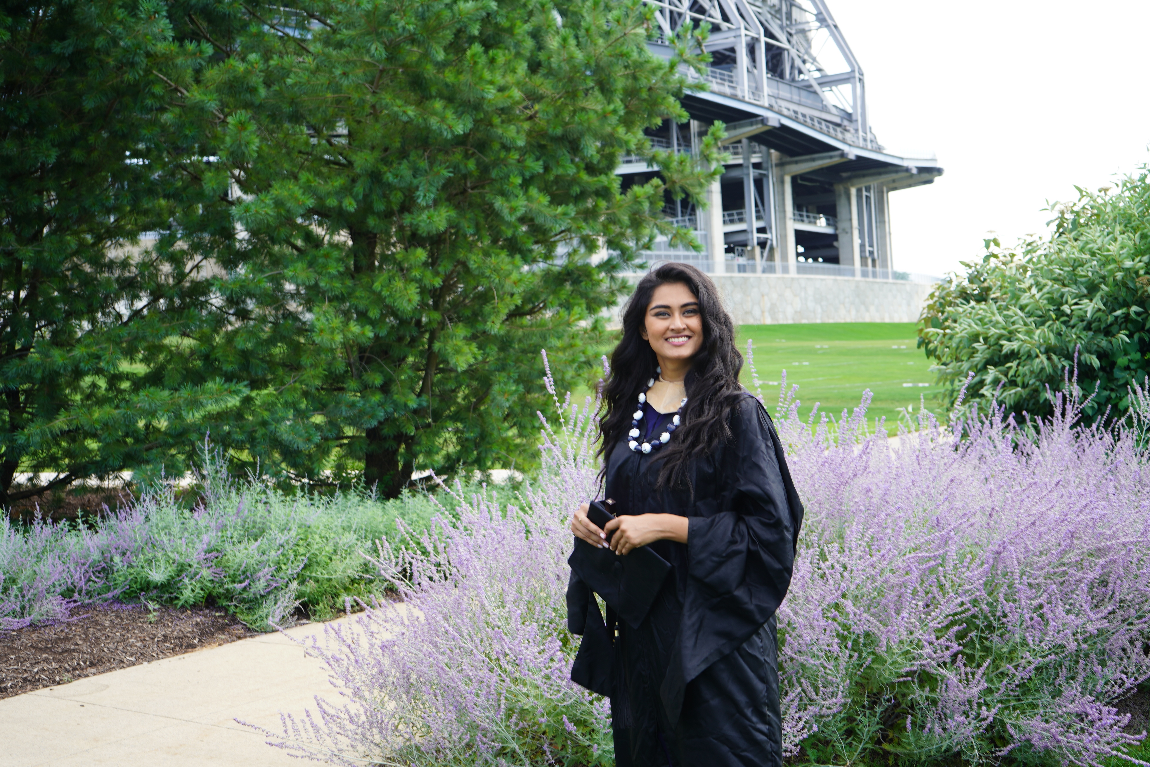 Sanjana in her graduation gown at Penn State